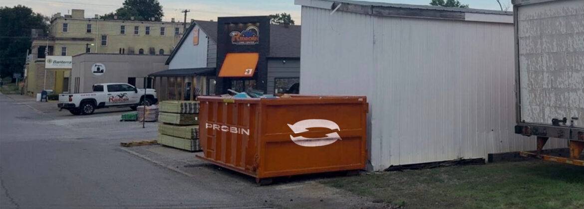 a dumpster next to a building